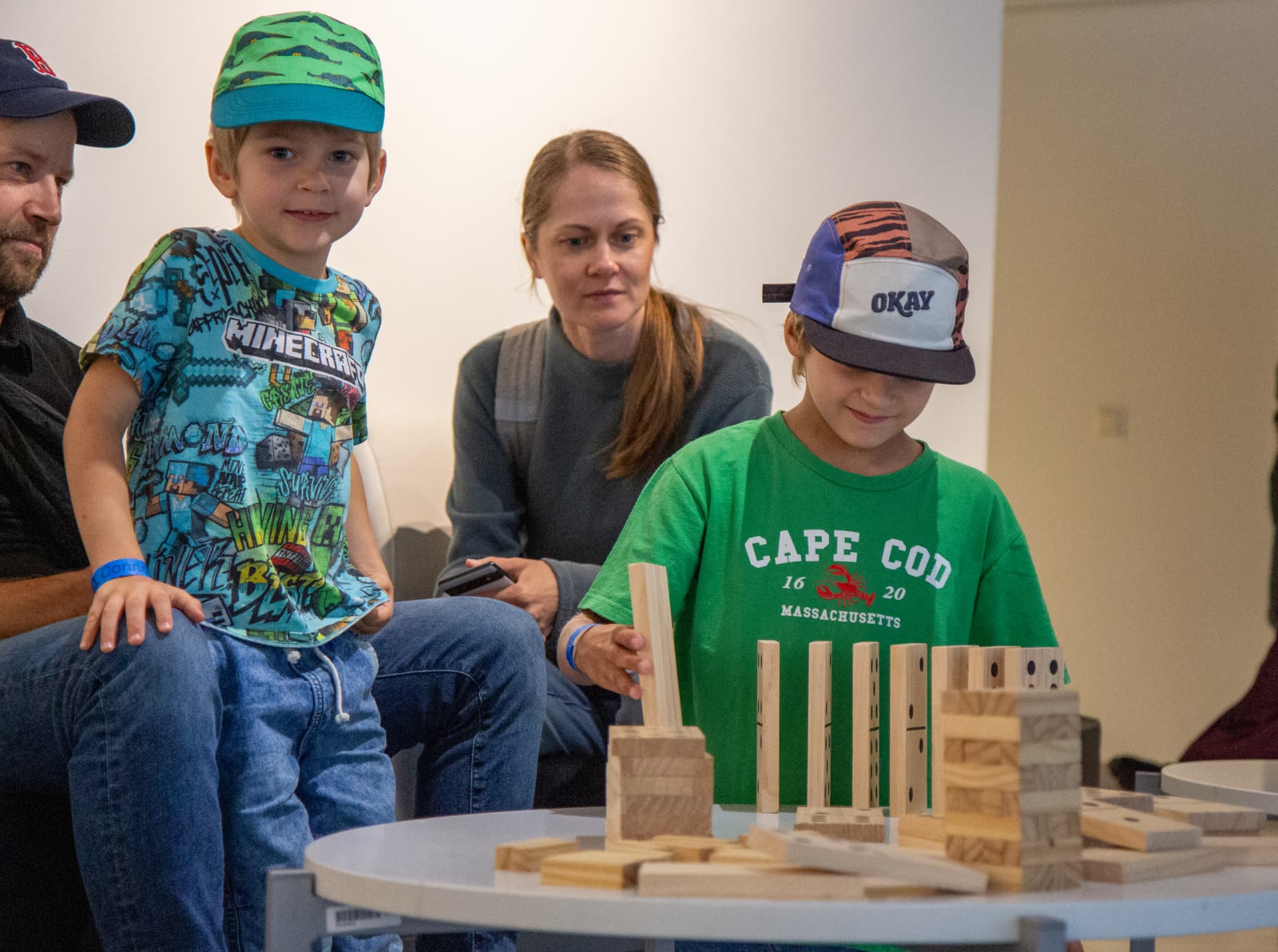 Kids building with wooden blocks in the kids area