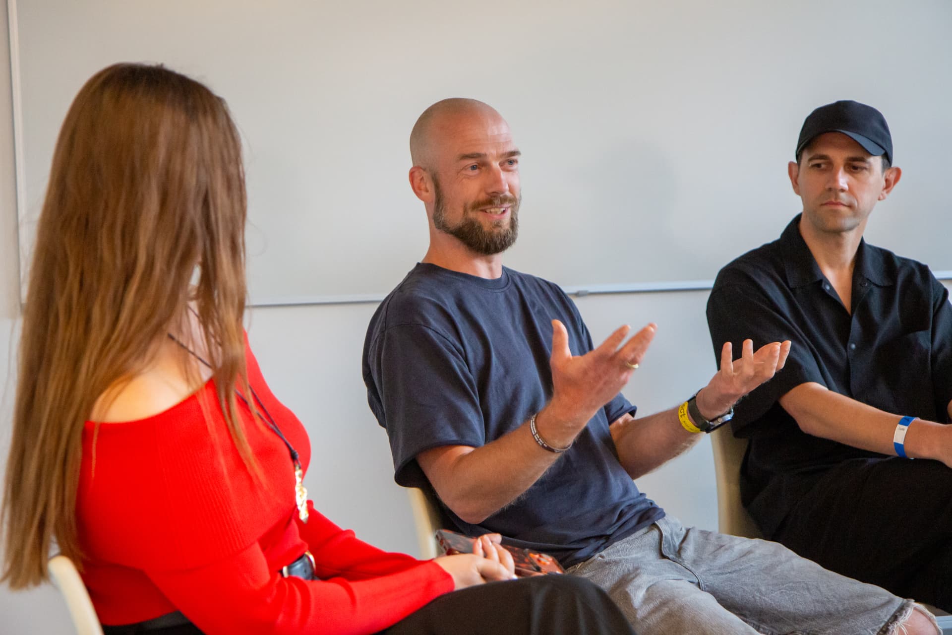 Panel discussion with speakers in a workshop room